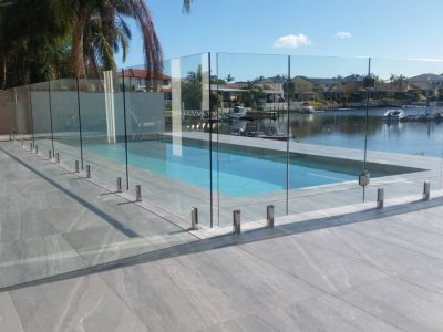 Glass pool fencing on canal