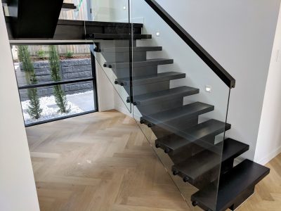 black-stairscase-with-glass-balustrade